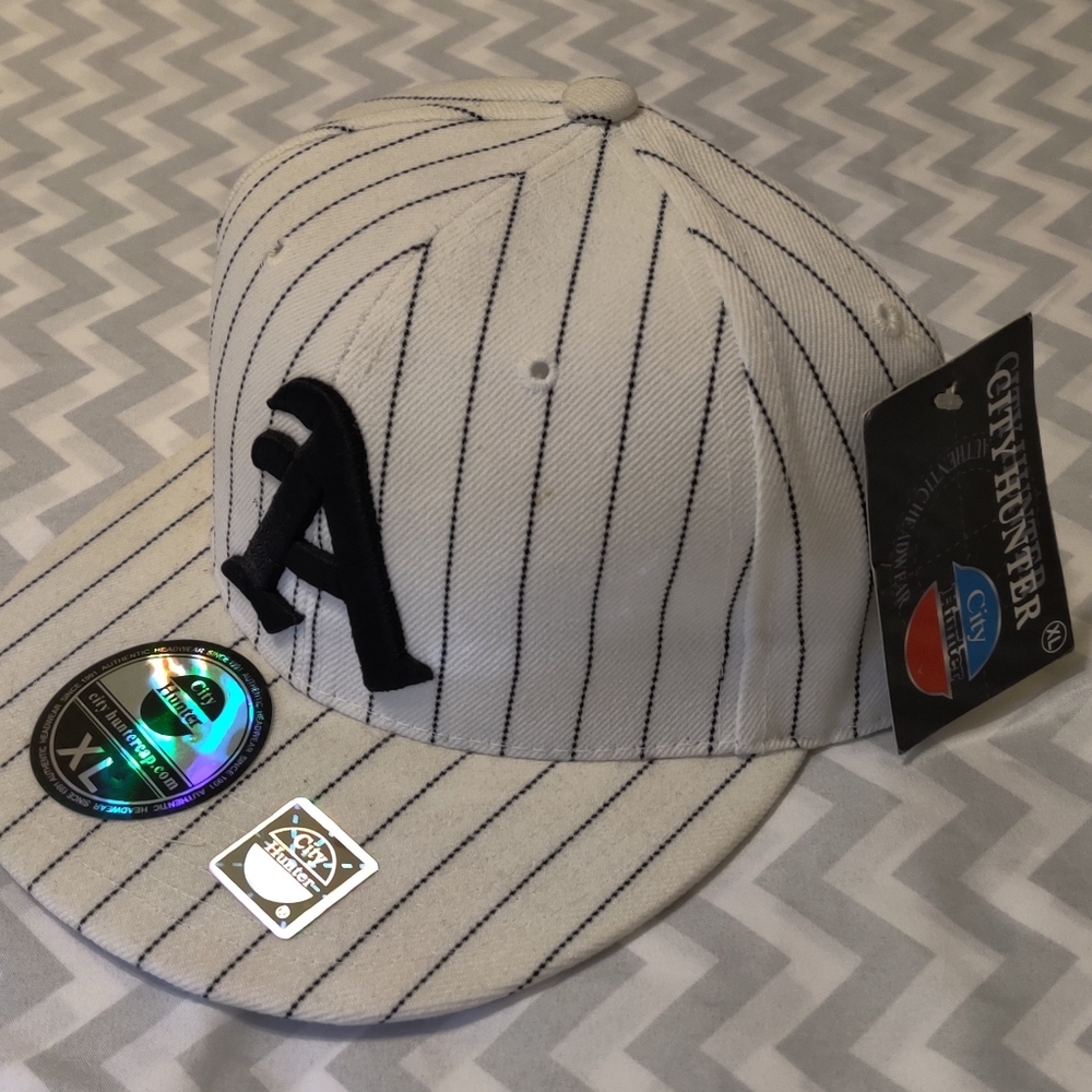 Atlanta pinstriped fitted, flat bill baseball cap.